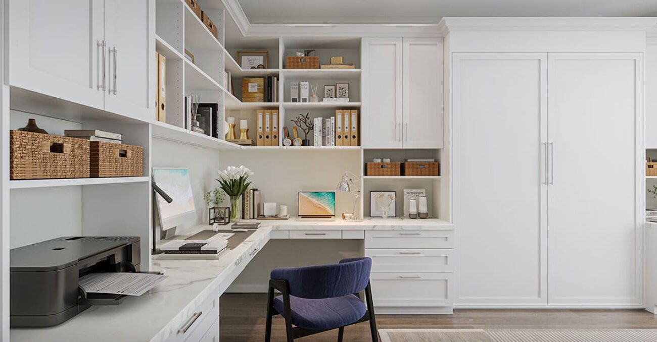 Home office with concealed built-in wall bed, wraparound desk, and open shelving.