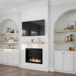 White base cabinets and wood floating shelving.