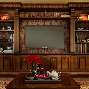 Classic cherrywood entertainment unit with detailed millwork, flanking bookshelves, crown molding, and base cabinetry.