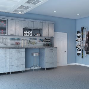 Industrial style garage system with textured steel cabinetry, omni track storage for seasonal sports gear, and slatwall organizer for tools.