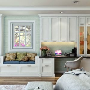 White shaker wall unit with built-in window seat and work station.