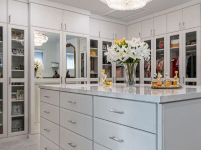 custom built walk in closet in light grray